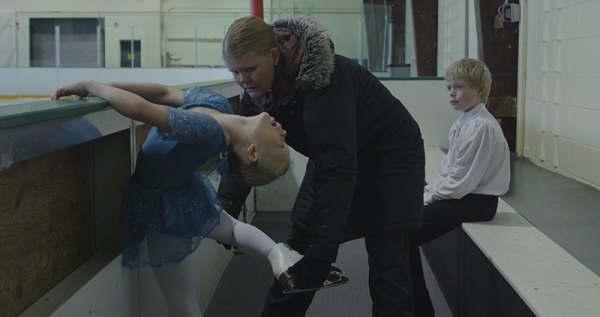 Kiss and Cry, Liz Magic Laser, 2015, single-channel 4K video, 13:30 minutes, video still. With figure skaters Anna MacKenzie and Axel MacKenzie and coach Marie Jonsson MacKenzie. Commissioned and produced by Mercer Union.